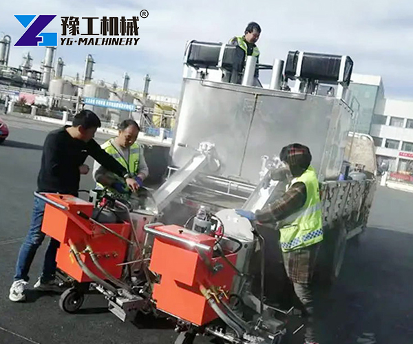 Road marking machine in operation