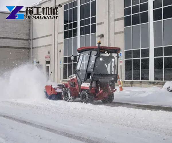 Snow sweeper for clearing accumulated snow from roads